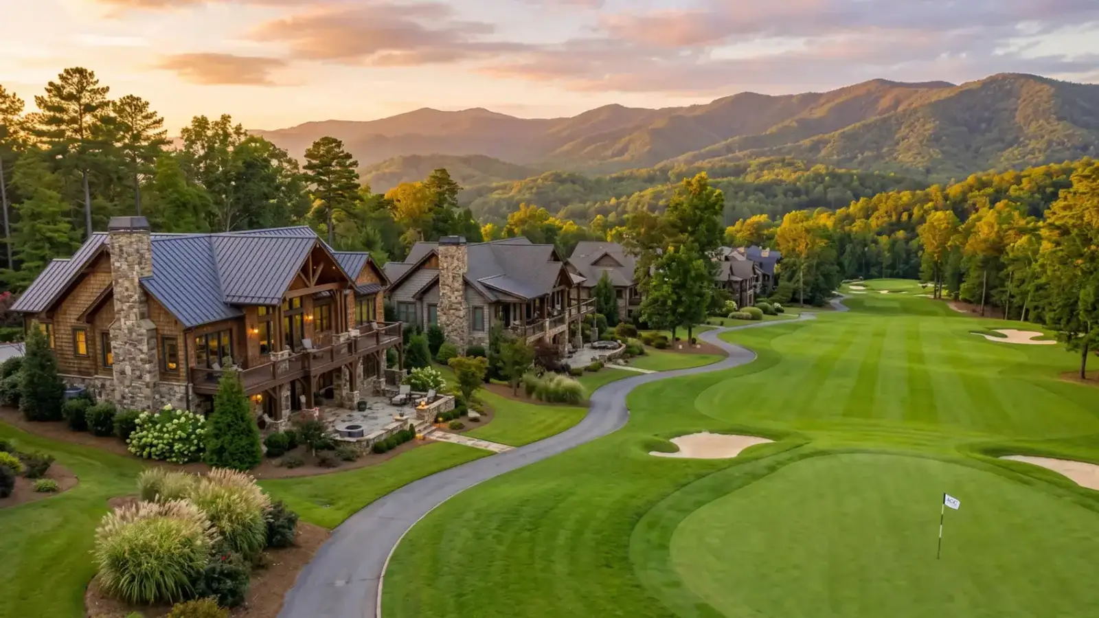 Luxury golf-community homes overlooking a fairway with Blue Ridge mountain views in North Georgia
